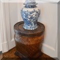 F17. One of a pair of woven stands or side tables. 